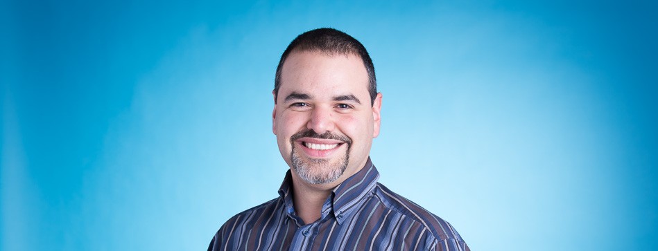 Portrait of Edgar with blue background